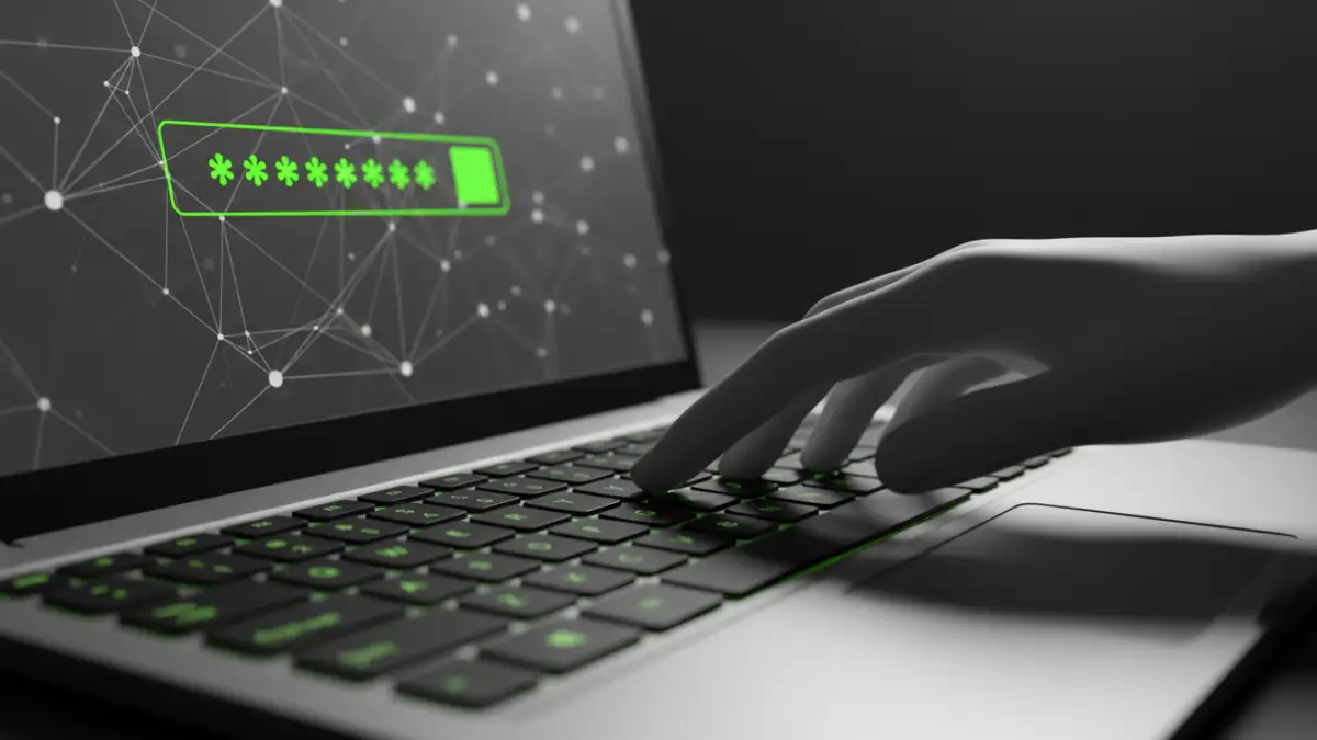 password protect documents - Typing a strong password into a laptop for document security